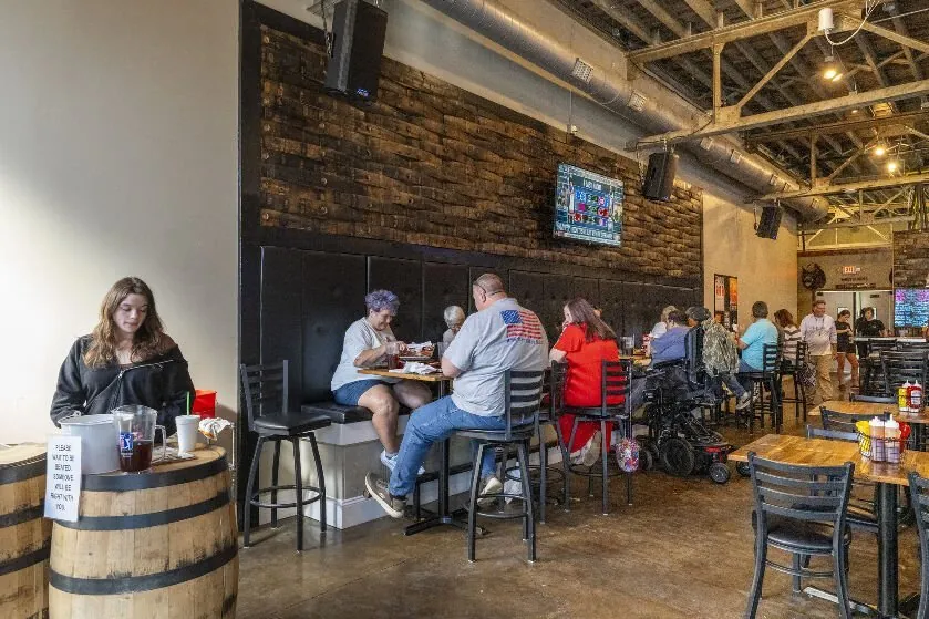 Ole Crow Tavern interior with barrel-stave wall