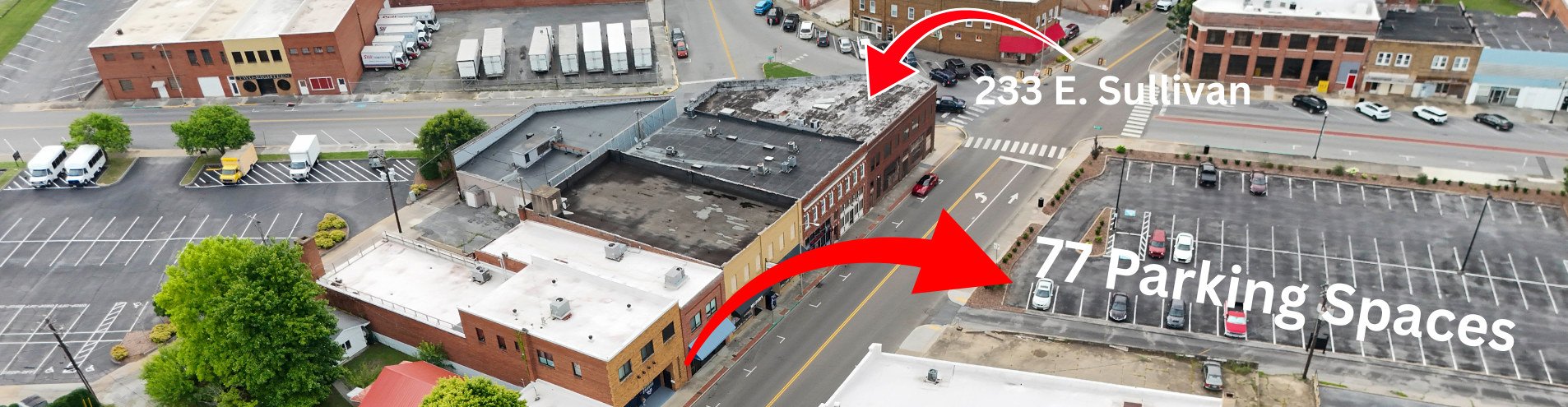 Aerial view of 233 E Sullivan Street showing the 77 free parking spaces next door