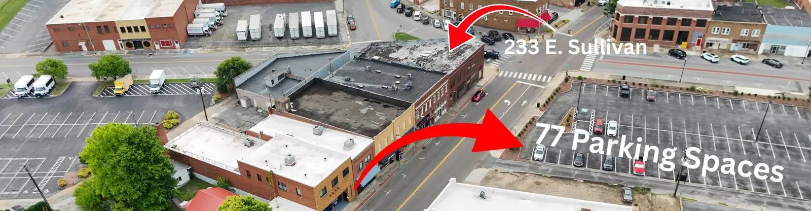 Aerial view of 233 E Sullivan Street showing the 77 free parking spaces next door