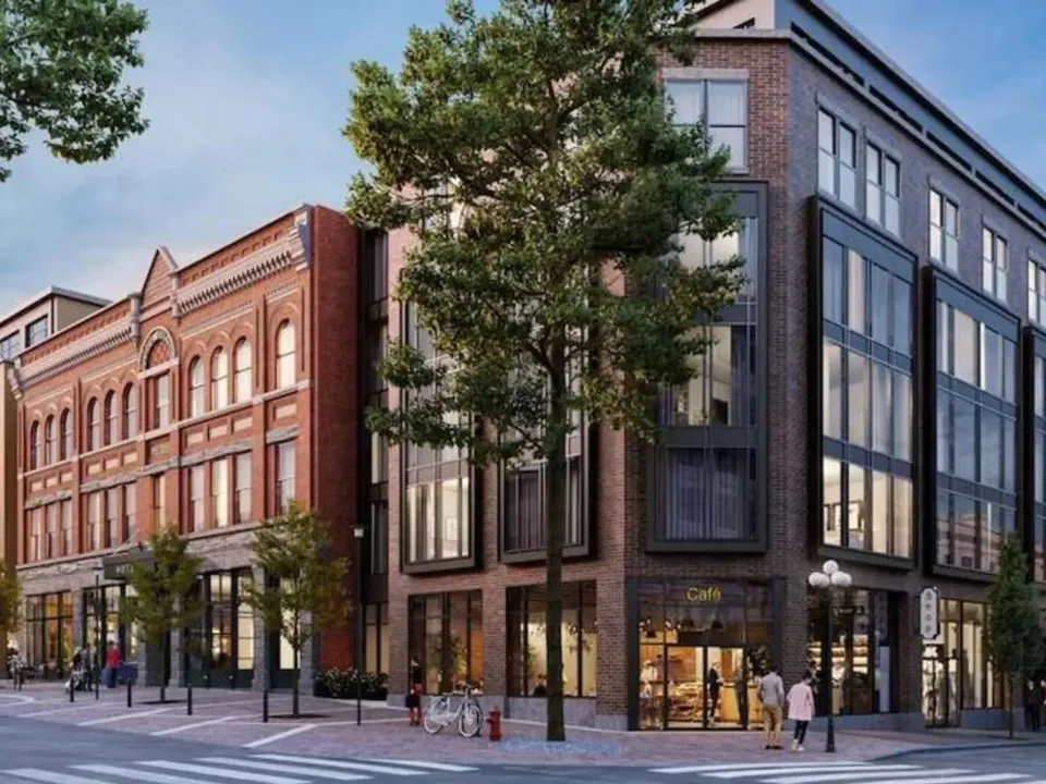 Historic brick building redeveloped alongside new mixed-use construction
